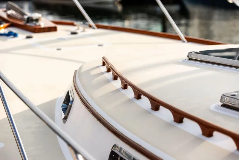 Slide: The Image of 1994 Little Harbor Express boat deck with wooden trim and metal fittings. - 16