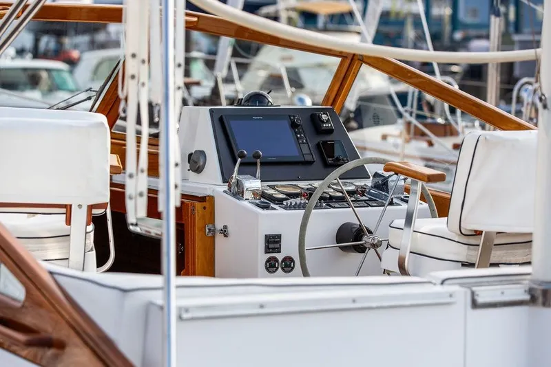 Slide: The Image of 1994 Little Harbor Express yacht helm with modern navigation equipment and wooden accents. - 17