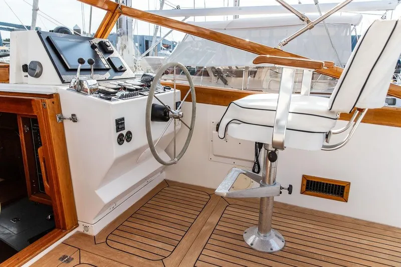 Slide: The Image of 1994 Little Harbor Express boat helm with wooden accents and captain's chair. - 20