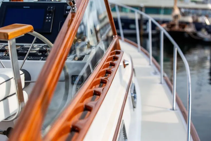 Slide: The Image of Close-up of 1994 Little Harbor Express yacht's polished wooden deck and control panel. - 22