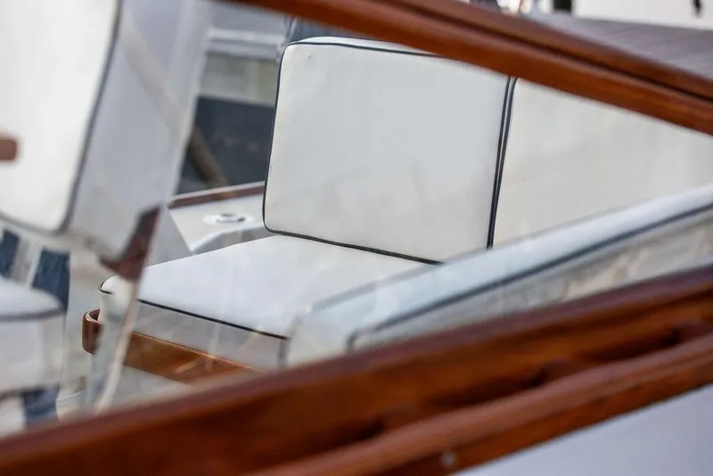 Slide: The Image of 1994 Little Harbor Express boat with white cushioned seating and wooden trim. - 25