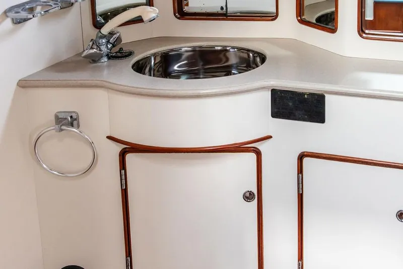 Slide: The Image of 1994 Little Harbor Express yacht interior with sink and storage cabinets. - 26