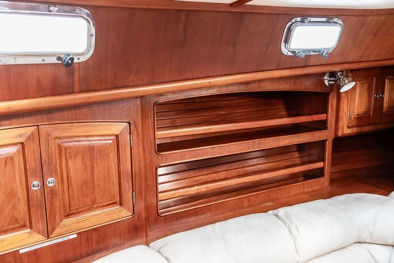 Slide: The Image of 1994 Little Harbor Express yacht interior with wooden cabinetry and shelving. - 29