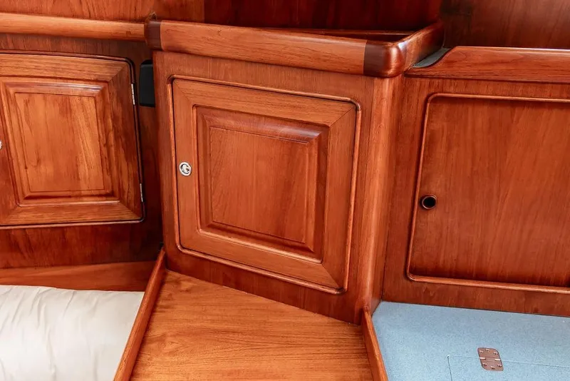 Slide: The Image of 1994 Little Harbor Express interior with polished wooden cabinetry and storage compartments. - 31