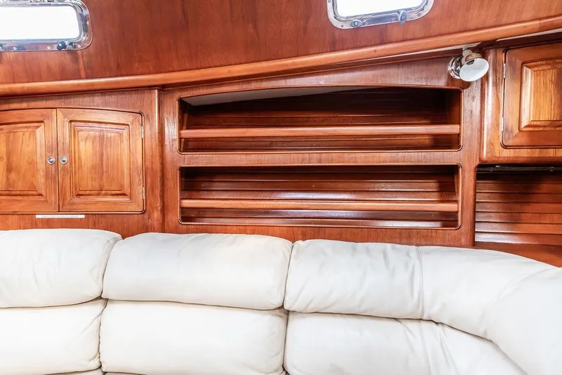 Slide: The Image of Luxurious wooden interior of 1994 Little Harbor Express yacht with white leather seating. - 34