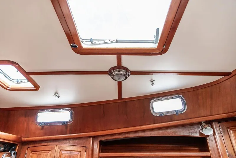 Slide: The Image of Interior view of 1994 Little Harbor Express boat with wooden finish and skylights. - 35