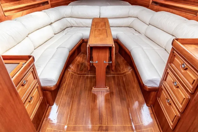 Slide: The Image of Luxurious 1994 Little Harbor Express yacht interior with elegant wood finish and plush seating. - 36