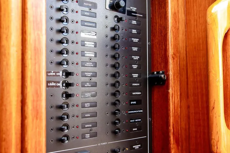 Slide: The Image of Control panel of a 1994 Little Harbor Express boat, featuring various switches and indicators. - 39