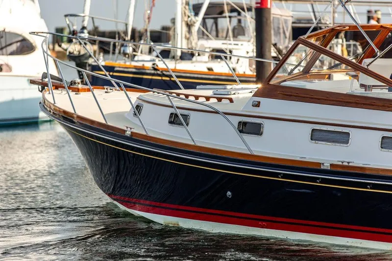 Slide: The Image of 1994 Little Harbor Express yacht docked in marina, showcasing elegant design and craftsmanship. - 43