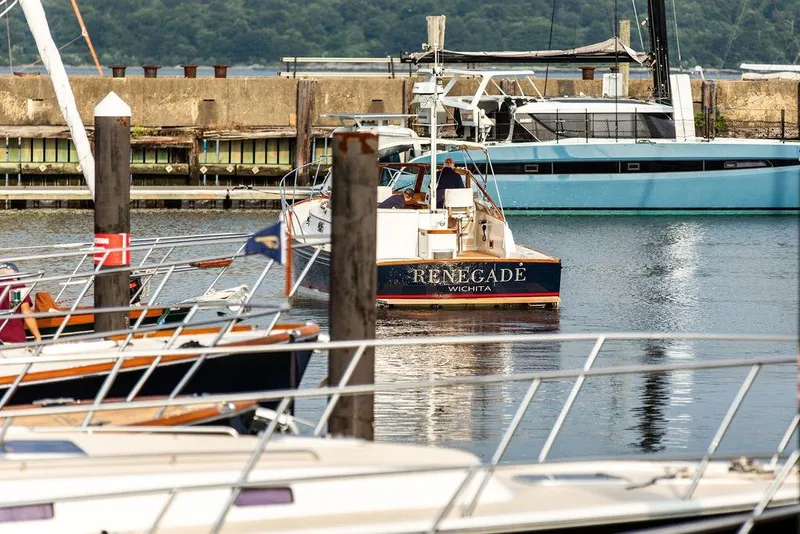 Slide: The Image of 1994 Little Harbor Express boat "Renegade" docked in a marina. - 46