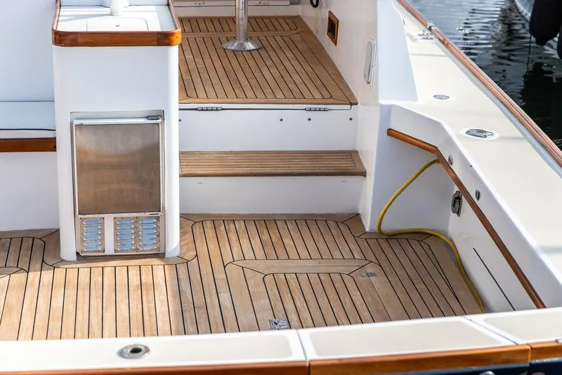 Slide: The Image of 1994 Little Harbor Express boat deck with teak flooring and built-in storage. - 49