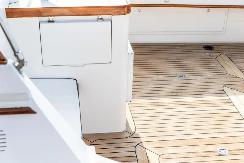 Slide: The Image of 1994 Little Harbor Express boat deck with teak flooring and white seating. - 51