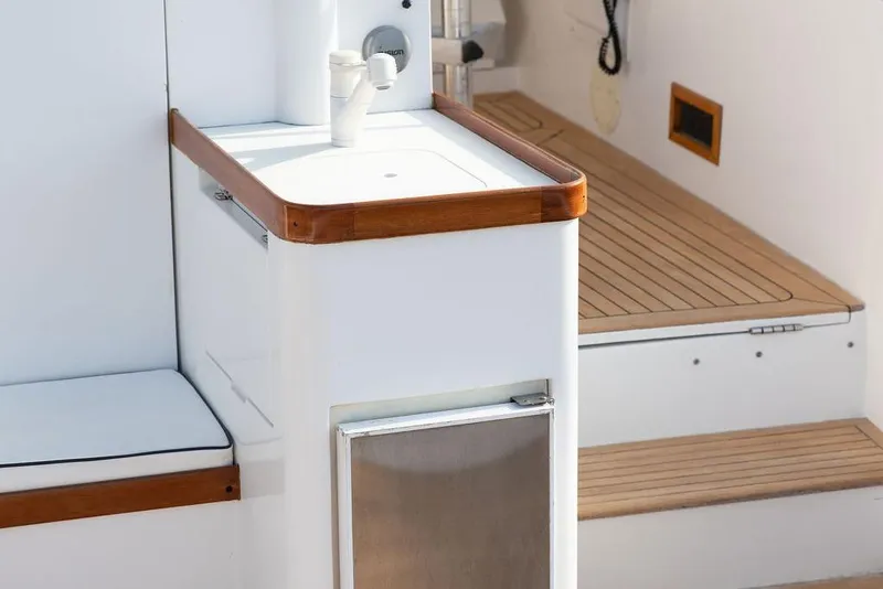 Slide: The Image of 1994 Little Harbor Express yacht interior with sink and wooden accents. - 52