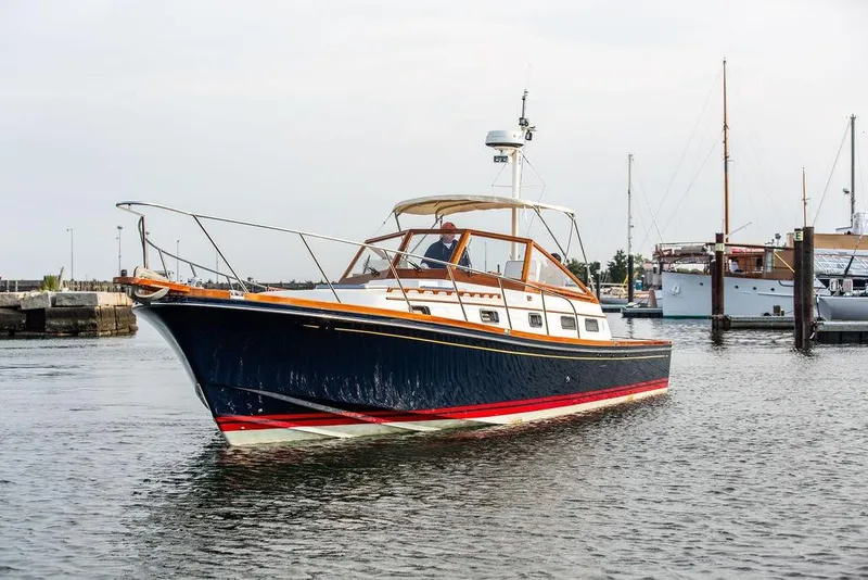 Slide: The Image of 1994 Little Harbor Express boat cruising in a marina, featuring classic design and elegant lines. - 53