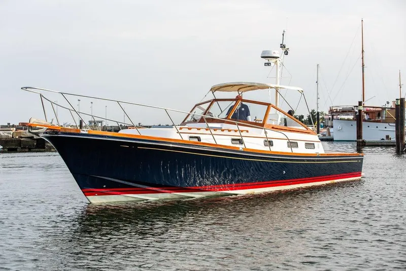 Slide: The Image of 1994 Little Harbor Express yacht on calm water, featuring sleek design and classic styling. - 54