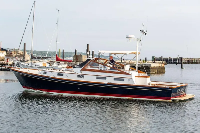 Slide: The Image of 1994 Little Harbor Express yacht docked in a marina, featuring sleek design and classic styling. - 55