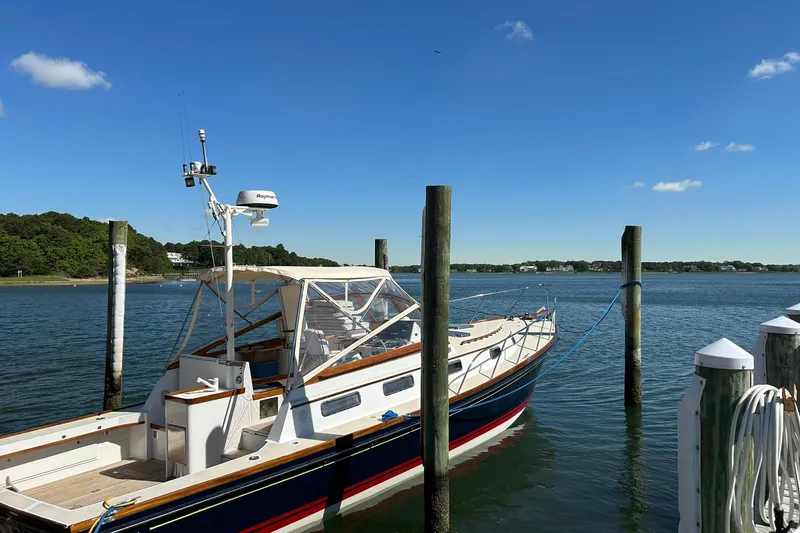 Slide: The Image of 1994 Little Harbor Express boat docked on a sunny day with clear blue skies. - 6