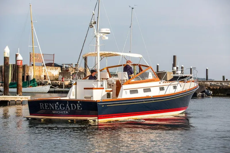 Slide: The Image of 1994 Little Harbor Express boat "Renegade" docked in a marina, Wichita. - 60