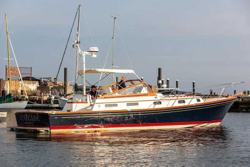 Slide: The Image of 1994 Little Harbor Express boat docked in a marina, featuring classic design and elegant detailing. - 63