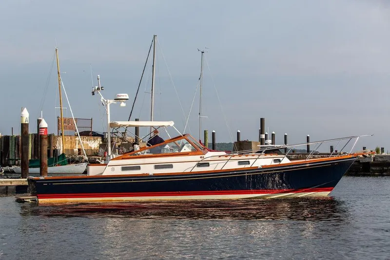 Slide: The Image of 1994 Little Harbor Express yacht docked at a marina, side view. - 64