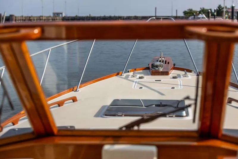 Slide: The Image of 1994 Little Harbor Express boat deck view with wooden trim and calm waters. - 71