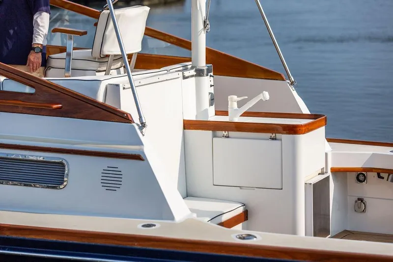Slide: The Image of 1994 Little Harbor Express boat deck with wooden accents and seating area. - 72