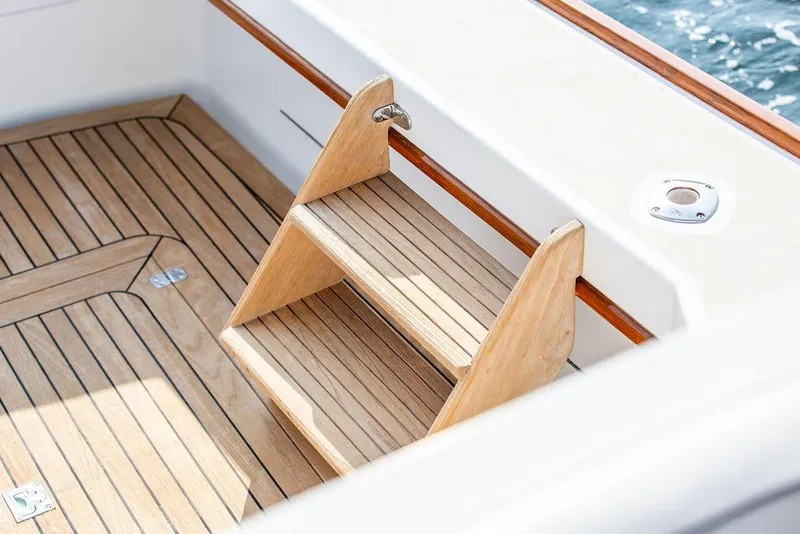 Slide: The Image of Wooden steps on 1994 Little Harbor Express boat deck, featuring elegant teak finish. - 73