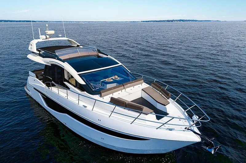 Slide: The Image of 2023 Galeon 470 Sky yacht cruising on open water, showcasing sleek design and luxury features. - 7