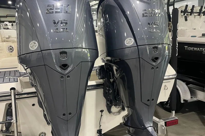 Slide: The Image of 2024 Cobia 265 Open Center Console with dual 250 V6 outboard engines. - 11