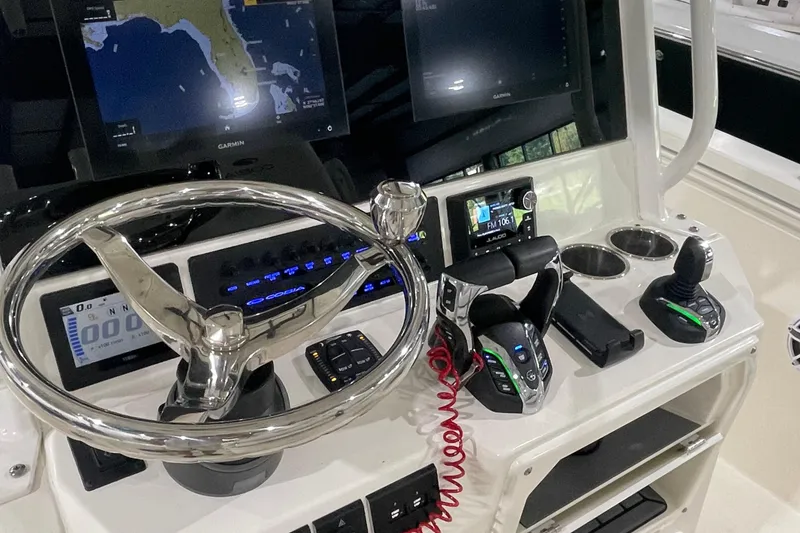 Slide: The Image of 2024 Cobia 265 Open Center Console dashboard with advanced navigation and control systems. - 17