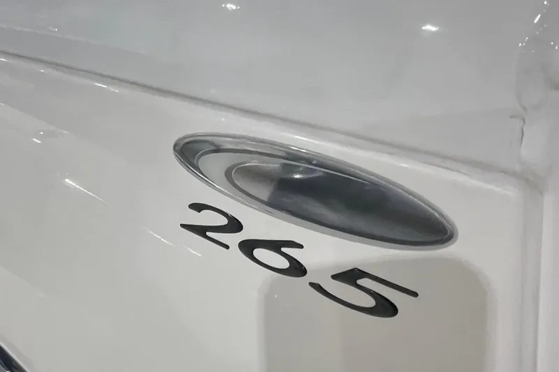 Slide: The Image of 2024 Cobia 265 Open Center Console boat detail with sleek design. - 18