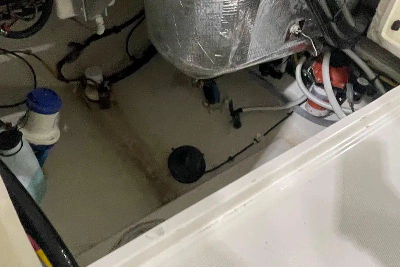 Slide: The Image of 2024 Cobia 265 Open Center Console interior wiring and components. - 22