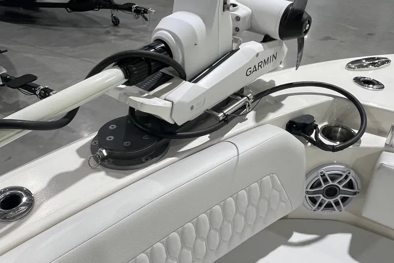 Slide: The Image of 2024 Cobia 265 Open Center Console with Garmin equipment and sleek interior design. - 26