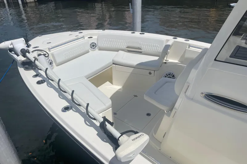 Slide: The Image of 2024 Cobia 265 Open Center Console boat with spacious seating and modern design. - 7