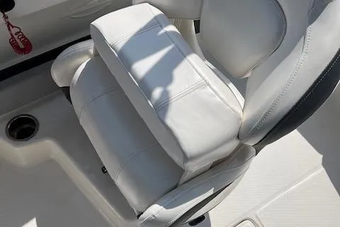 Slide: The Image of 2021 Chaparral 21 SSi OB boat seat, white leather upholstery, close-up view. - 11