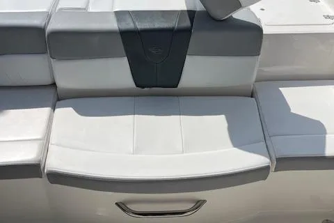 Slide: The Image of 2021 Chaparral 21 SSi OB boat seat, featuring sleek gray and white upholstery. - 14