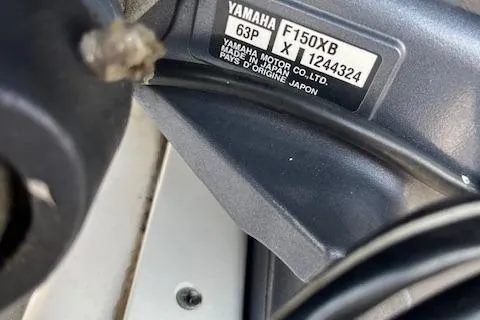 Slide: The Image of Close-up of a Yamaha F150XB engine label on a 2021 Chaparral 21 SSi OB boat. - 19