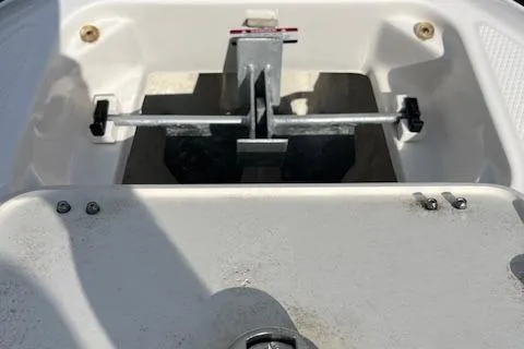 Slide: The Image of 2021 Chaparral 21 SSi OB boat anchor compartment with metal fittings. - 6