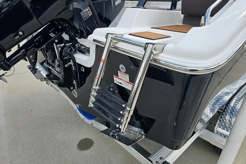 Slide: The Image of 2026 Sea Pro 225 Sandbar boat with motor and swim ladder on trailer. - 15