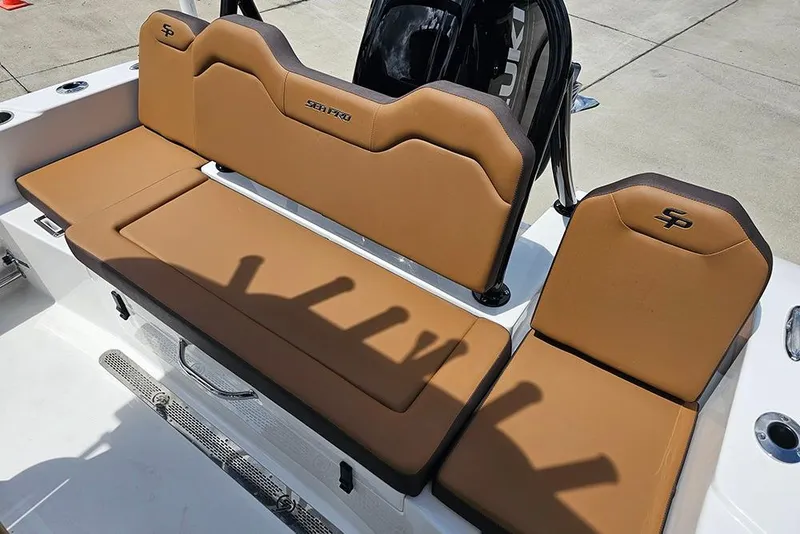 Slide: The Image of 2026 Sea Pro 225 Sandbar boat seating with tan upholstery and logo detailing. - 16