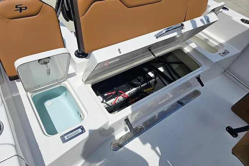 Slide: The Image of 2026 Sea Pro 225 Sandbar boat interior with open storage compartments and seating. - 17