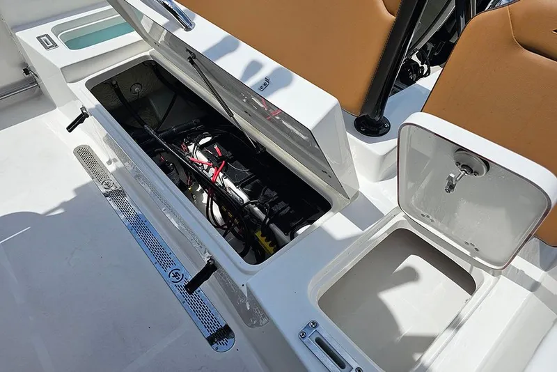 Slide: The Image of 2026 Sea Pro 225 Sandbar boat storage compartments with open hatches and visible wiring. - 18
