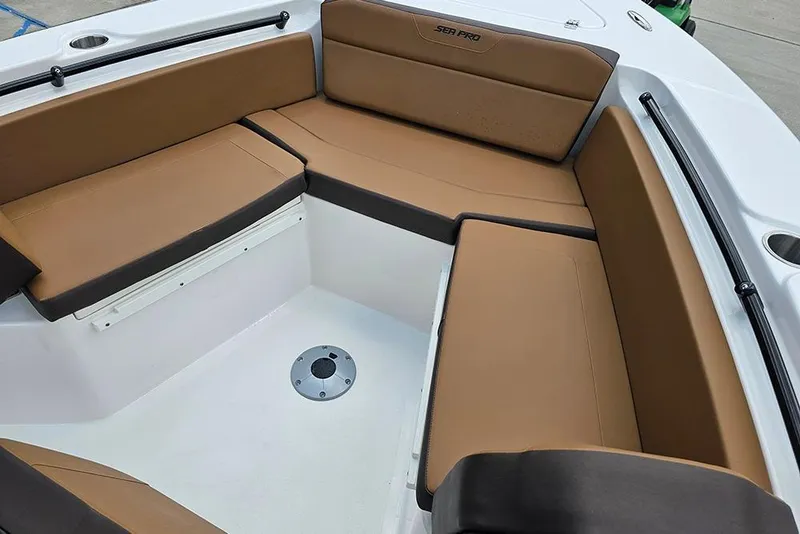 Slide: The Image of 2026 Sea Pro 225 Sandbar boat interior with brown cushioned seating. - 30