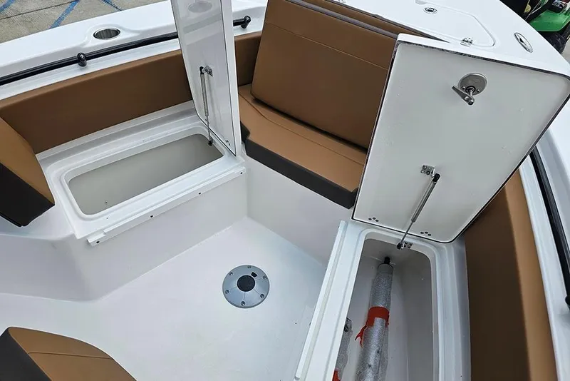 Slide: The Image of 2026 Sea Pro 225 Sandbar boat interior with open storage compartments and seating. - 31