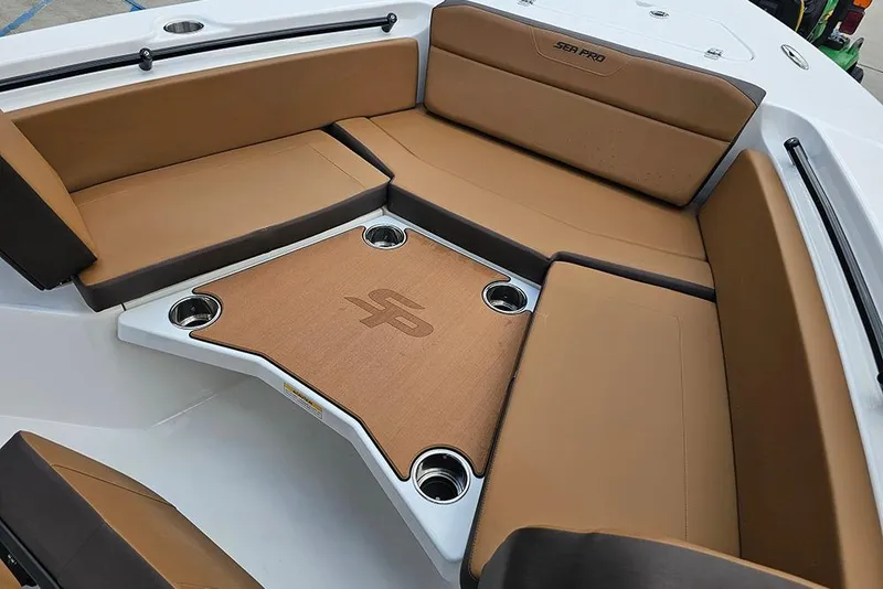 Slide: The Image of Luxurious seating area on 2026 Sea Pro 225 Sandbar boat with cup holders. - 32