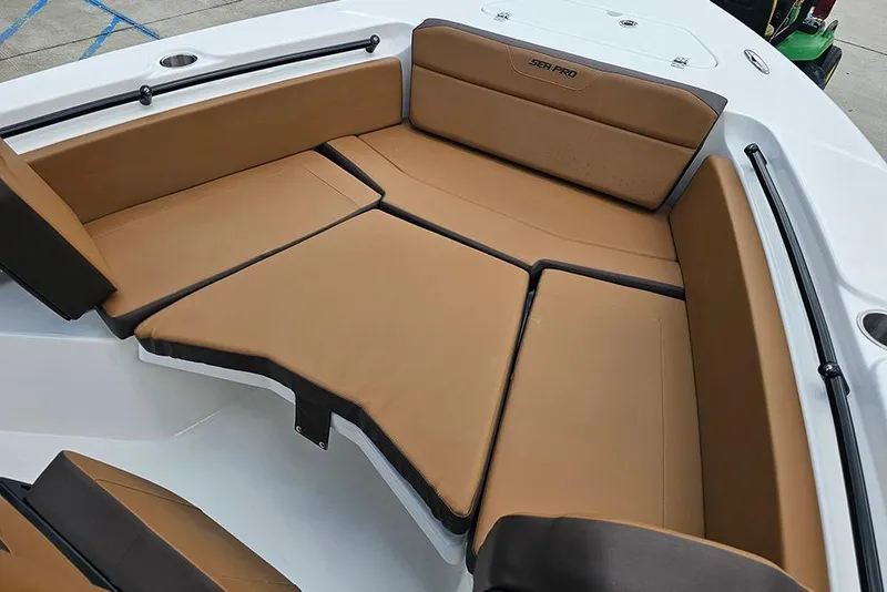 Slide: The Image of 2026 Sea Pro 225 Sandbar boat interior with tan cushioned seating. - 33