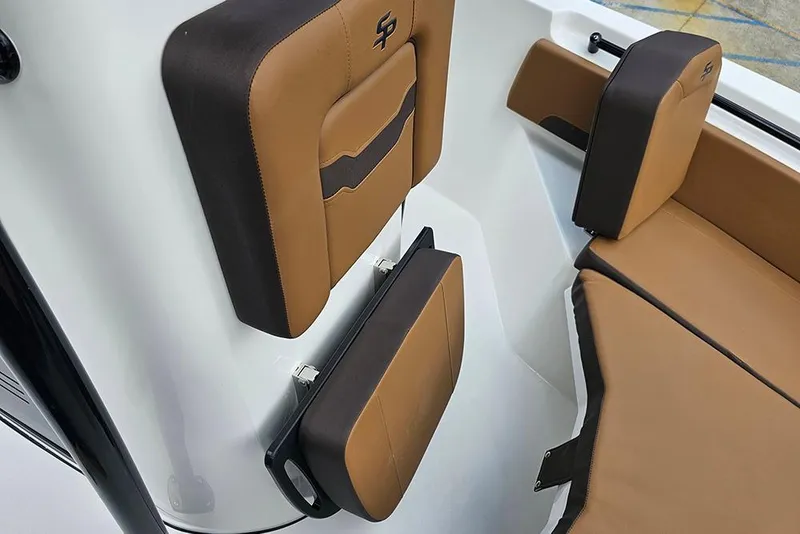 Slide: The Image of 2026 Sea Pro 225 Sandbar boat interior with brown and black cushioned seating. - 34