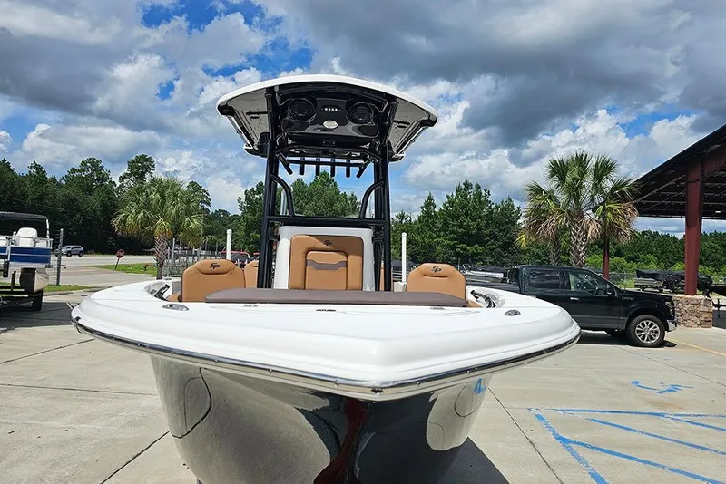 Slide: The Image of 2026 Sea Pro 225 Sandbar boat on display under a cloudy sky. - 4