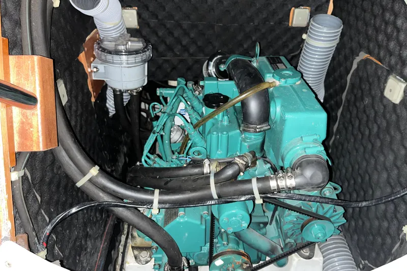 Slide: The Image of Engine compartment of a 2001 Beneteau First 40.7 sailboat, showcasing mechanical components. - 16
