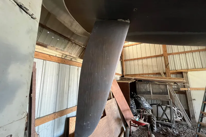 Slide: The Image of Keel of a 2001 Beneteau First 40.7 sailboat in a storage shed. - 26